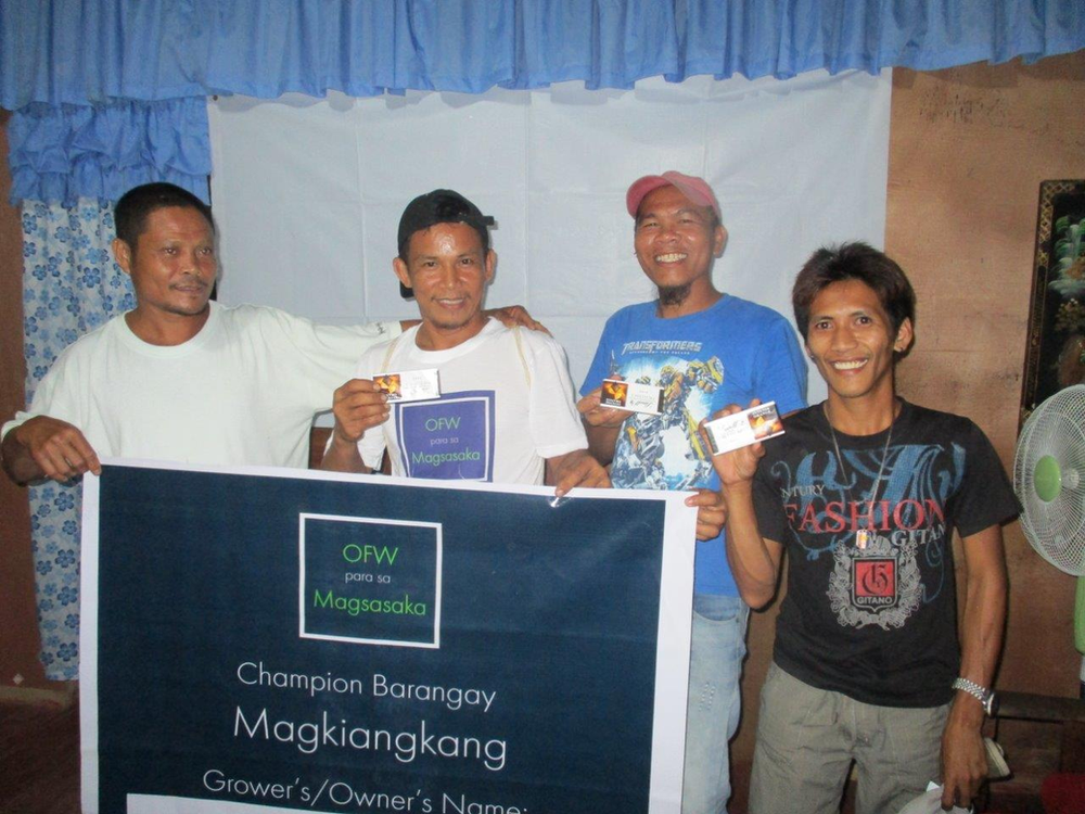 Chocolates and money, what great awards for well performing OPM cacao farmers. From left to right: (1) Top 2 Improved Farm Winner - Efren Simbahon; (2) In complete OPM uniform including bag and notebook Winner Emmanuel Pelago; (3) General Assembly Early Bird and Top 2 Improved Farm Winner - Dan Pedraza; and General Assembly Early Bird Winner - Elpidio Ruiz.